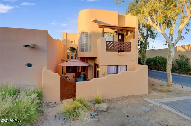 southwest-style home with a balcony