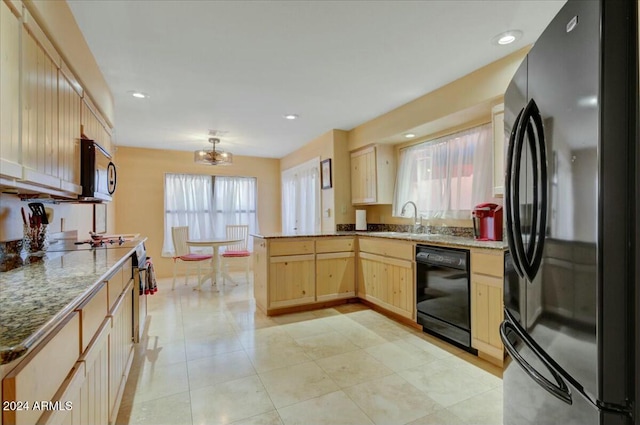 kitchen featuring black appliances, sink, light brown cabinetry, kitchen peninsula, and a chandelier