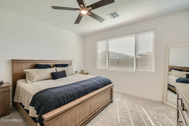 bedroom featuring ceiling fan and light colored carpet