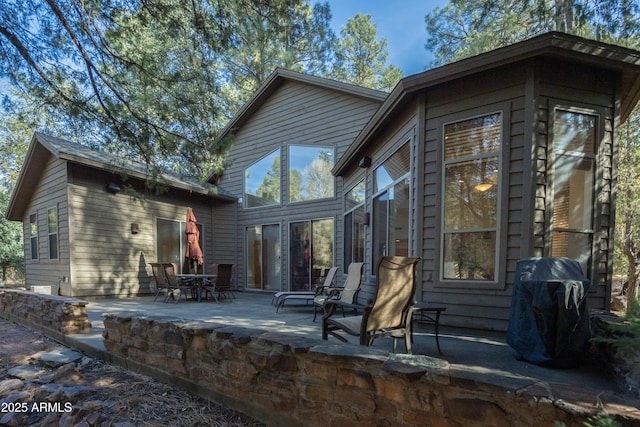 rear view of property with a patio area