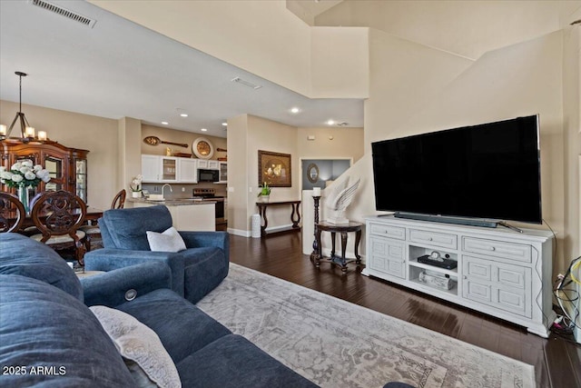16420 N Thompson Peak Pkwy Unit 1002, Scottsdale, AZ 85260 - living area with dark wood-style floors, a chandelier, recessed lighting, and baseboards