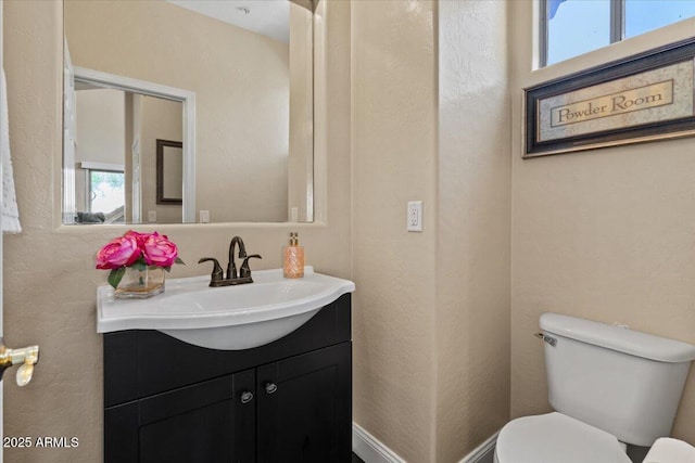 16420 N Thompson Peak Pkwy Unit 1002, Scottsdale, AZ 85260 - half bath with toilet, vanity, and a textured wall