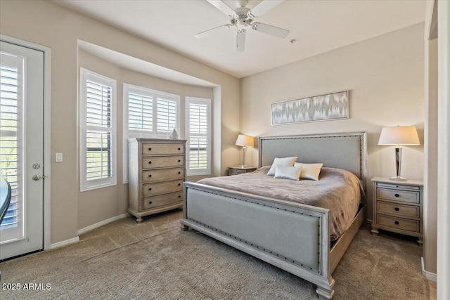 16420 N Thompson Peak Pkwy Unit 1002, Scottsdale, AZ 85260 - bedroom featuring carpet flooring, multiple windows, baseboards, and a ceiling fan