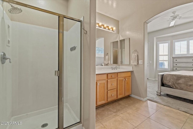 16420 N Thompson Peak Pkwy Unit 1002, Scottsdale, AZ 85260 - full bath with a shower stall, ceiling fan, vanity, ensuite bathroom, and tile patterned flooring
