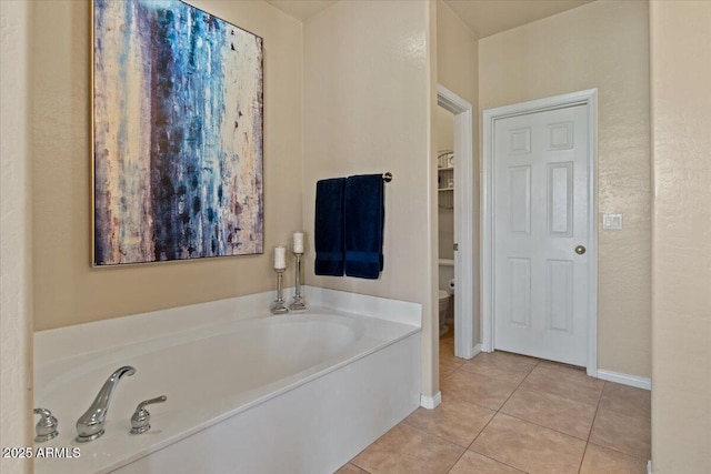 16420 N Thompson Peak Pkwy Unit 1002, Scottsdale, AZ 85260 - full bathroom featuring tile patterned flooring, a garden tub, and baseboards