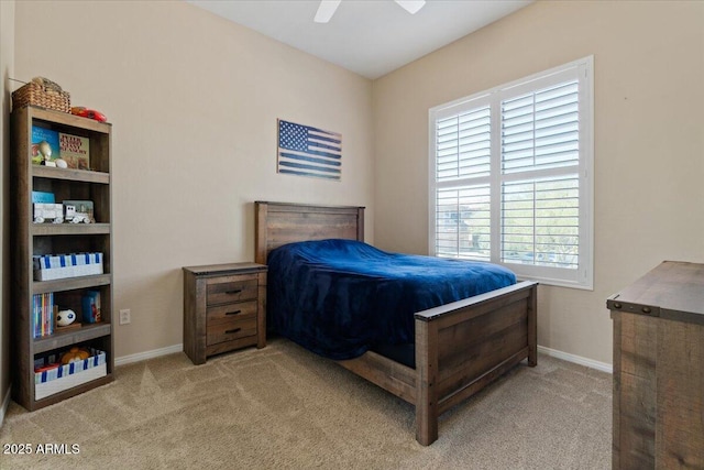 16420 N Thompson Peak Pkwy Unit 1002, Scottsdale, AZ 85260 - bedroom with light colored carpet, baseboards, and a ceiling fan