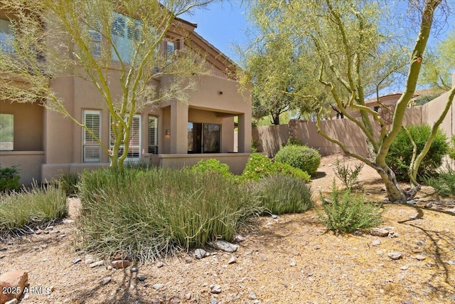 16420 N Thompson Peak Pkwy Unit 1002, Scottsdale, AZ 85260 - back of house with fence and stucco siding