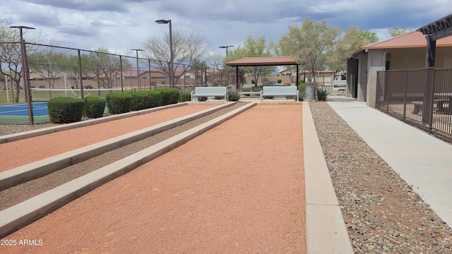 view of property's community with fence