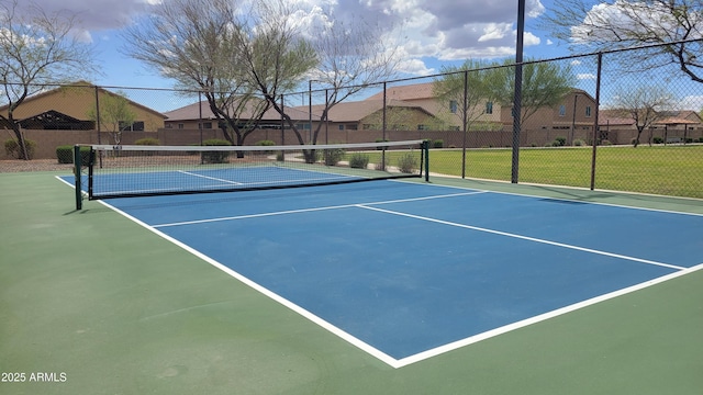 view of sport court with a residential view, community basketball court, and fence