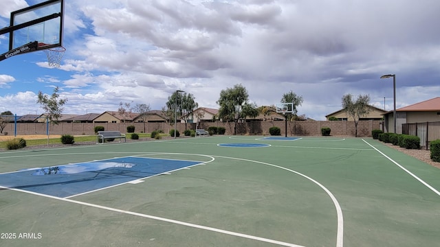 view of sport court featuring fence and community basketball court