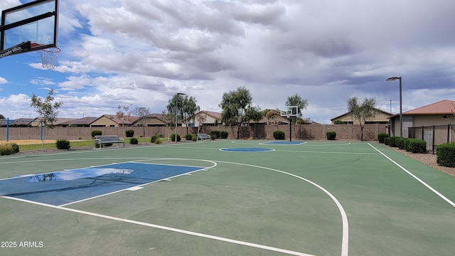 view of sport court featuring fence and community basketball court