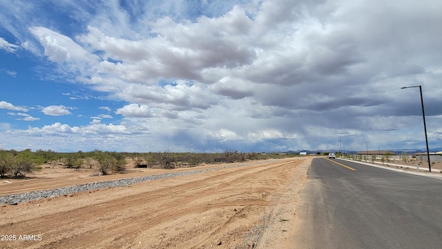 view of road featuring a rural view and street lighting