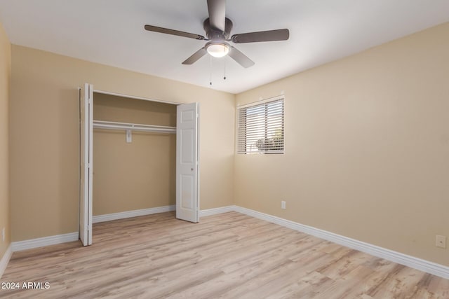 1340 N Recker Rd Unit 131, Mesa, AZ 85205 - unfurnished bedroom with wood finished floors, a closet, baseboards, and ceiling fan