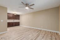 unfurnished living room with light wood-type flooring