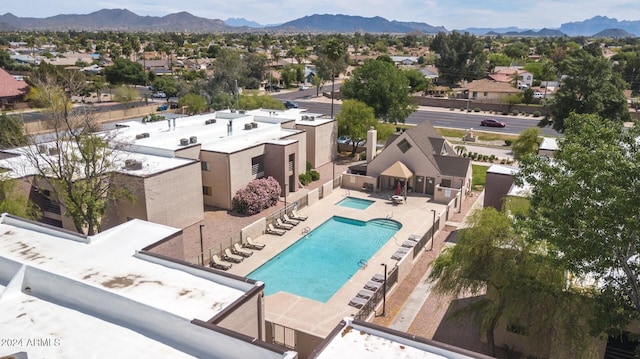1340 N Recker Rd Unit 131, Mesa, AZ 85205 - aerial perspective of suburban area featuring a pool and a mountain backdrop