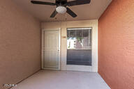 property entrance featuring ceiling fan