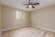 spare room with hardwood / wood-style flooring