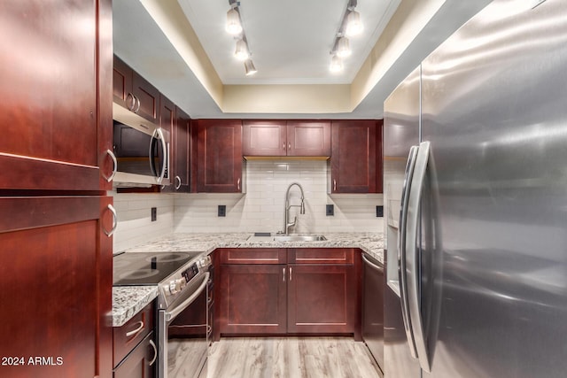 1340 N Recker Rd Unit 131, Mesa, AZ 85205 - kitchen featuring appliances with stainless steel finishes, a sink, and reddish brown cabinets