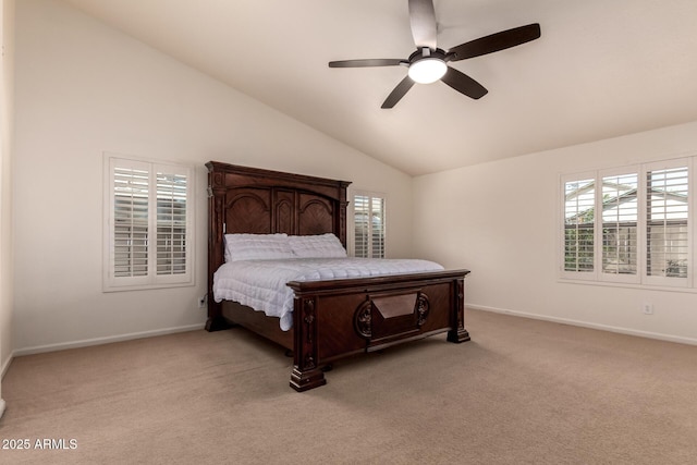 bedroom with light carpet, multiple windows, baseboards, and ceiling fan