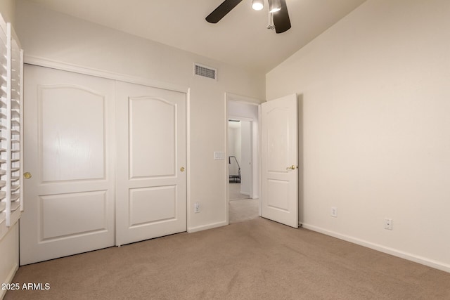 unfurnished bedroom featuring baseboards, visible vents, carpet floors, and a closet