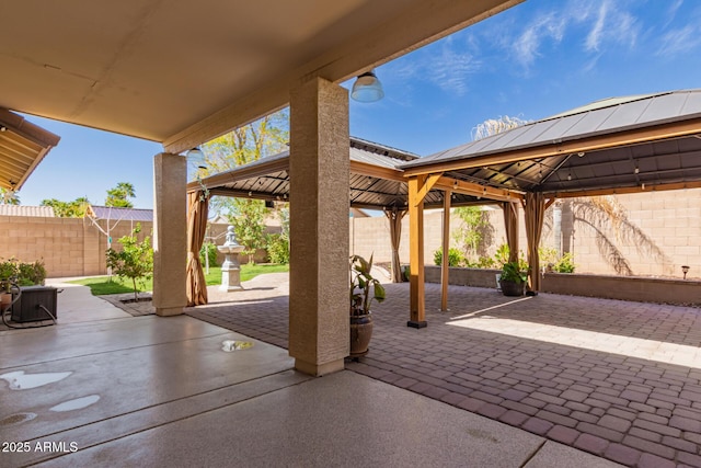 view of patio with a gazebo and a fenced backyard