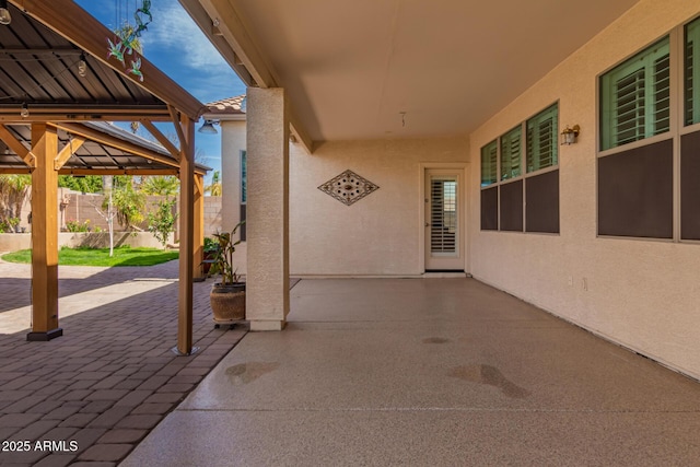 view of patio featuring a gazebo and fence