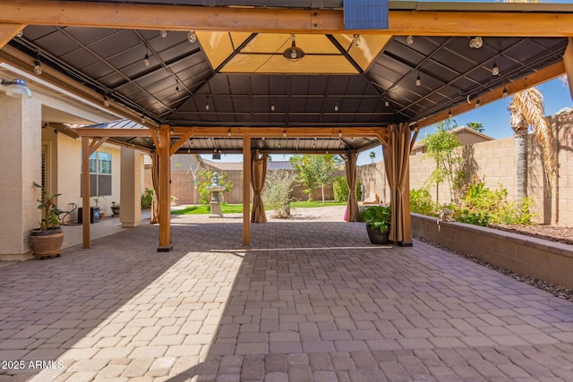 view of patio / terrace featuring a gazebo and a fenced backyard