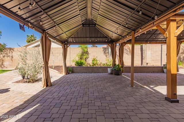 view of patio / terrace featuring a gazebo and a fenced backyard