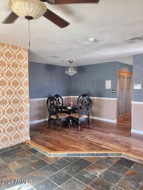 sitting room featuring dark hardwood / wood-style flooring and a textured ceiling