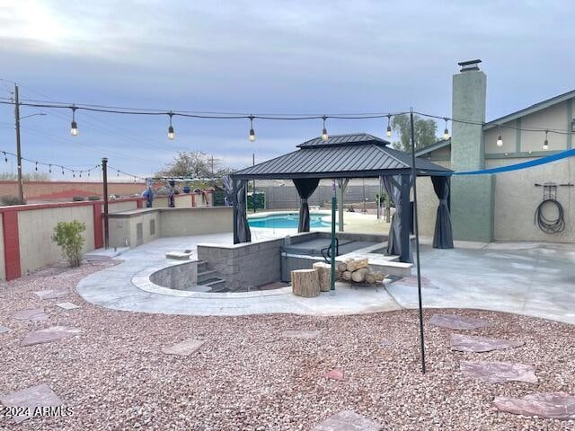 exterior space featuring a gazebo and a patio