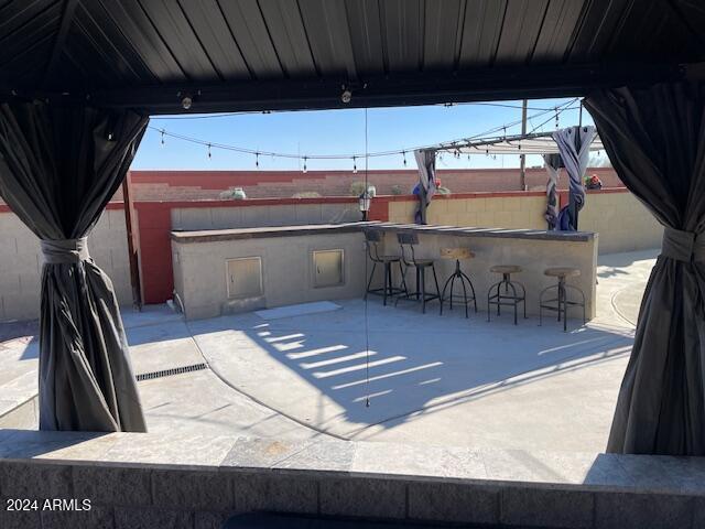 view of patio / terrace with an outdoor bar