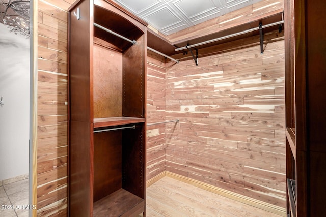 spacious closet featuring light hardwood / wood-style floors