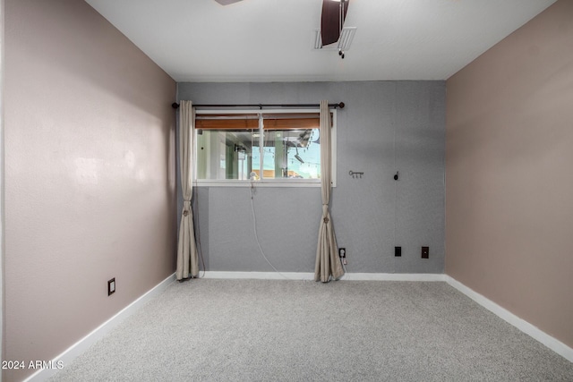 unfurnished room featuring carpet flooring and ceiling fan