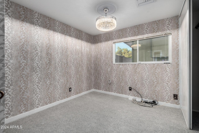 unfurnished room with carpet flooring