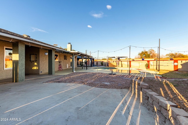 exterior space with a patio area and a swimming pool