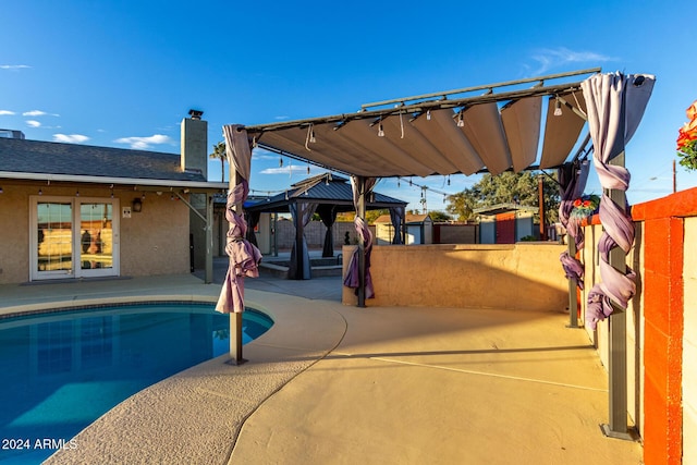 view of swimming pool featuring a gazebo and a patio