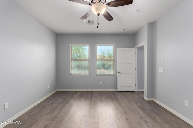 5550 N 16th St Unit 166, Phoenix, AZ 85016 - spare room with ceiling fan and wood finished floors