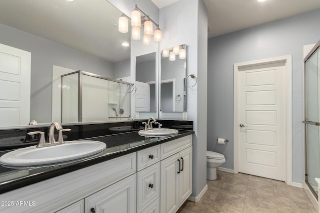 5550 N 16th St Unit 166, Phoenix, AZ 85016 - bathroom with a stall shower, double vanity, and recessed lighting