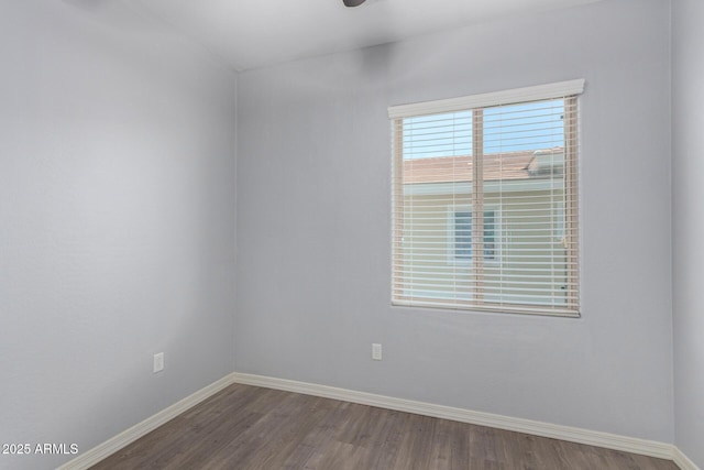 5550 N 16th St Unit 166, Phoenix, AZ 85016 - empty room with baseboards and dark wood finished floors