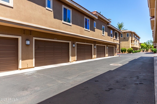 5550 N 16th St Unit 166, Phoenix, AZ 85016 - view of property featuring a garage and a residential view