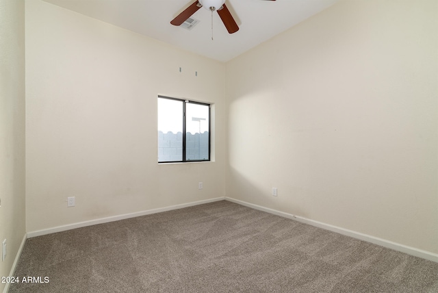 unfurnished room with lofted ceiling, ceiling fan, and carpet floors