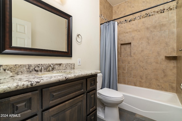 full bathroom featuring toilet, shower / bath combo, and vanity