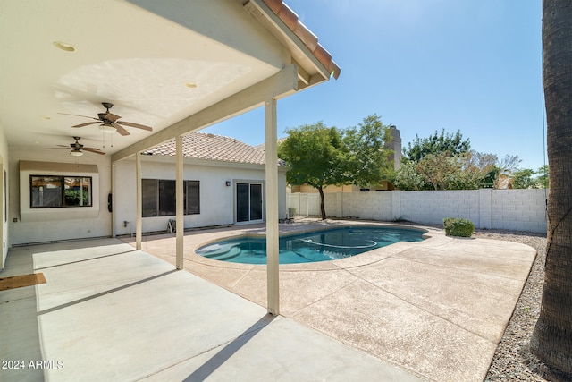 view of pool with ceiling fan and a patio area