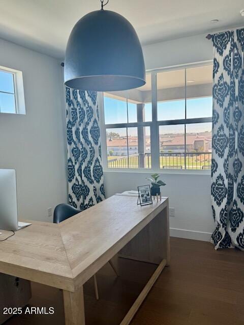 dining space with dark hardwood / wood-style flooring