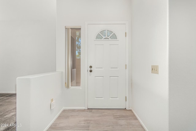 foyer with light wood-type flooring