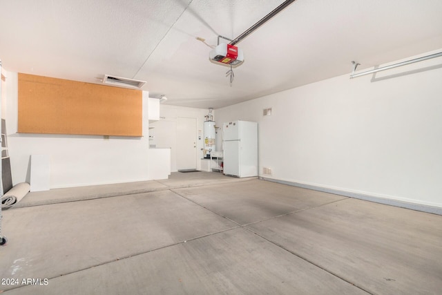 garage featuring gas water heater, a garage door opener, and white refrigerator