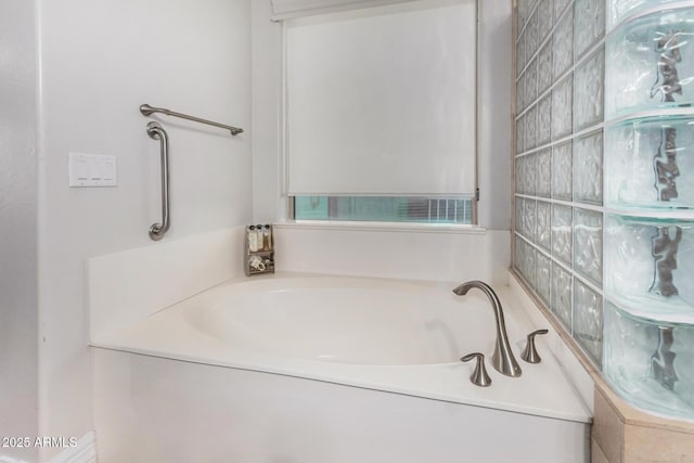 bathroom featuring a bath