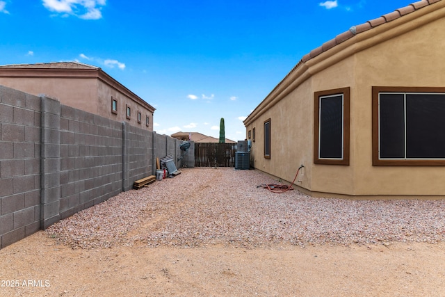 fenced backyard with central AC