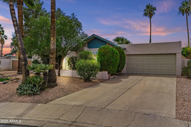 2916 S Revere Cir, Mesa, AZ 85210 - view of front of property with concrete driveway, stucco siding, and a garage