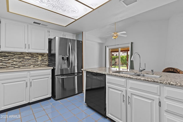 2916 S Revere Cir, Mesa, AZ 85210 - kitchen with stainless steel refrigerator with ice dispenser, black dishwasher, a sink, light tile patterned flooring, and backsplash